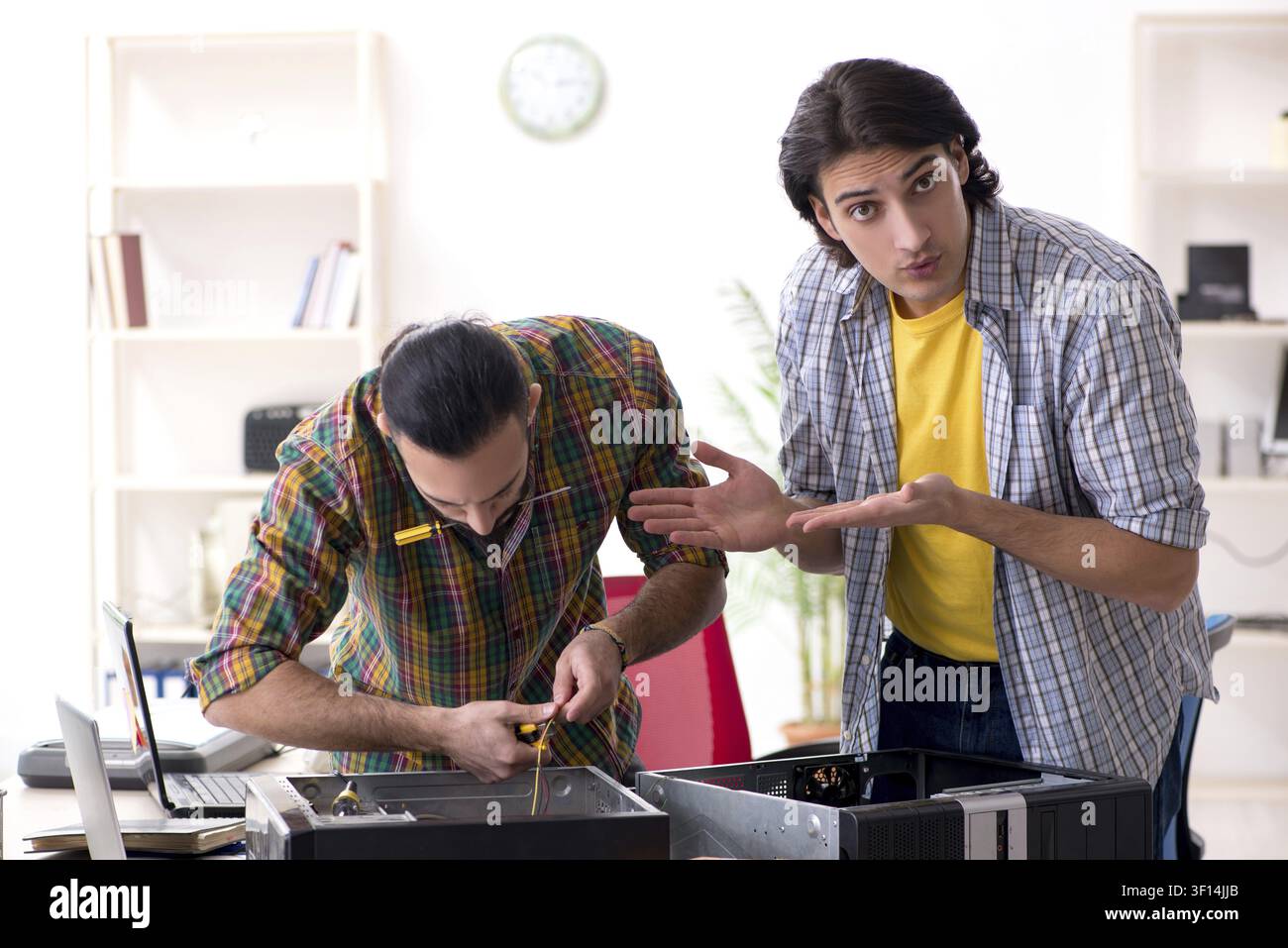 IT engineers working on hardware issue Stock Photo