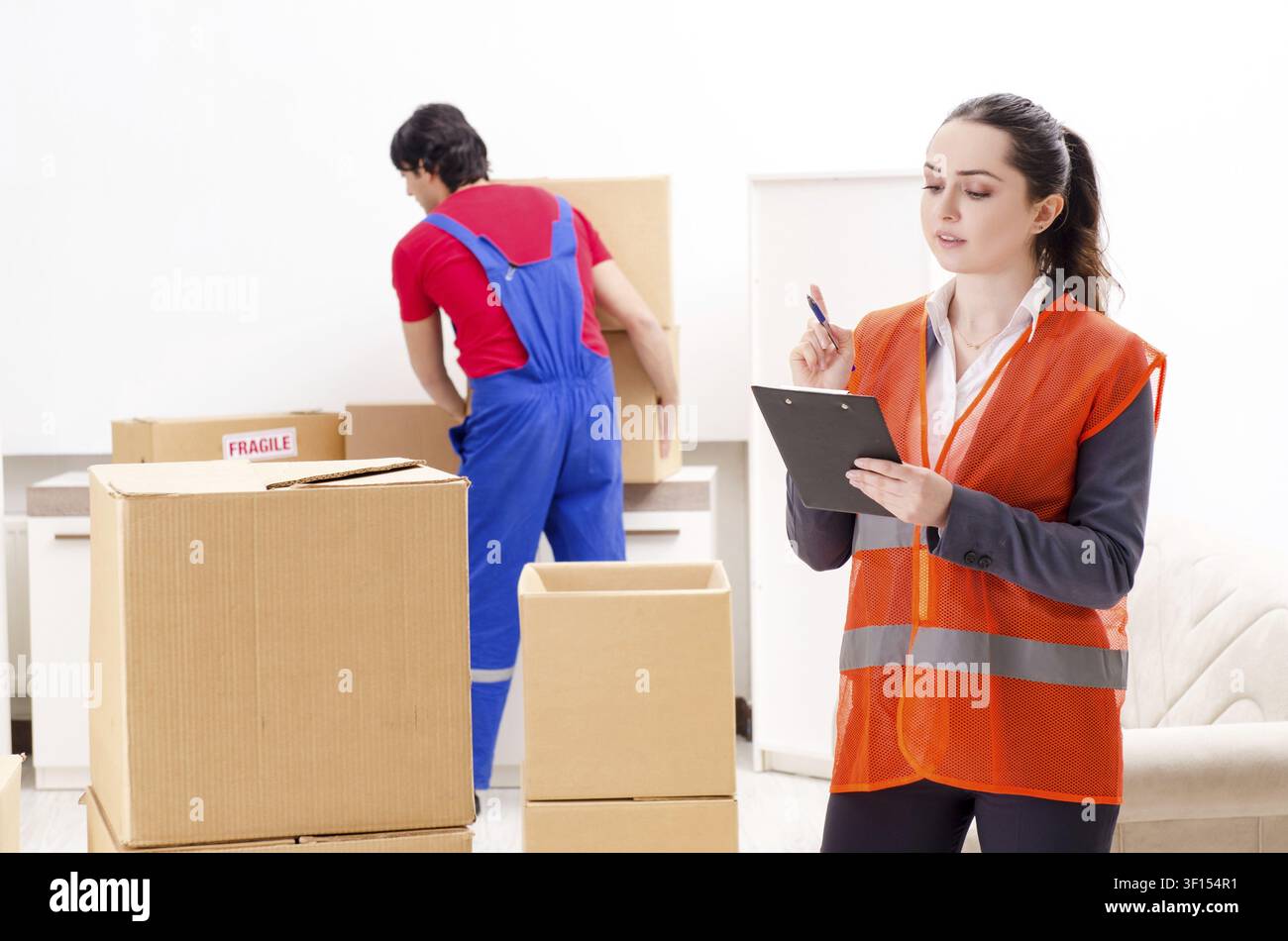 Professional movers doing home relocation Stock Photo