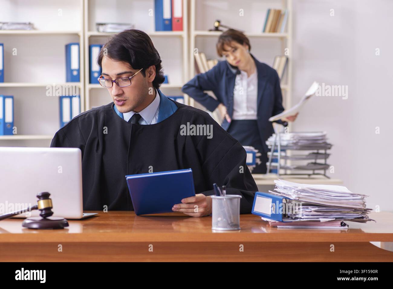 Two lawyers working in the office Stock Photo