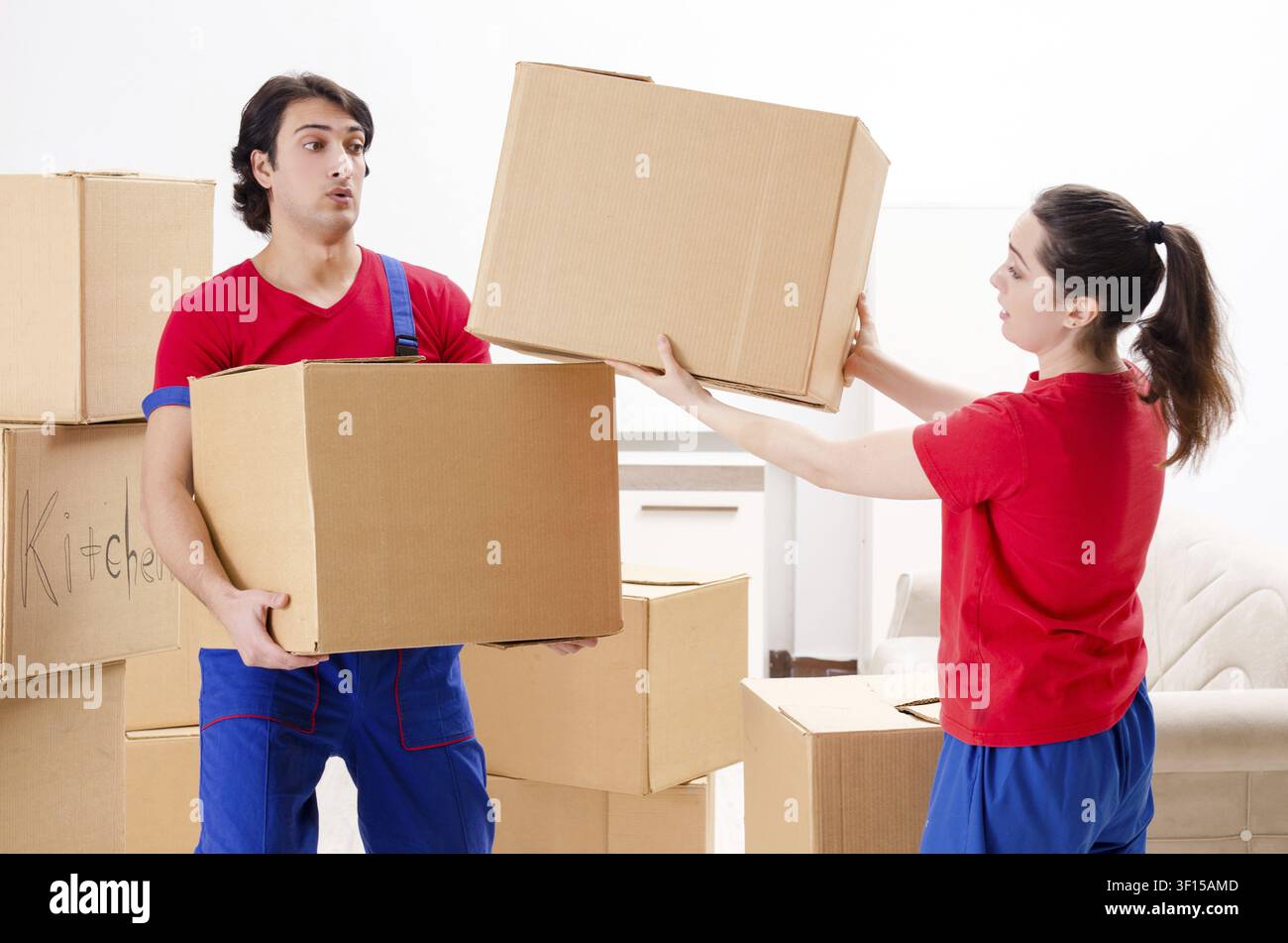 Professional movers doing home relocation Stock Photo