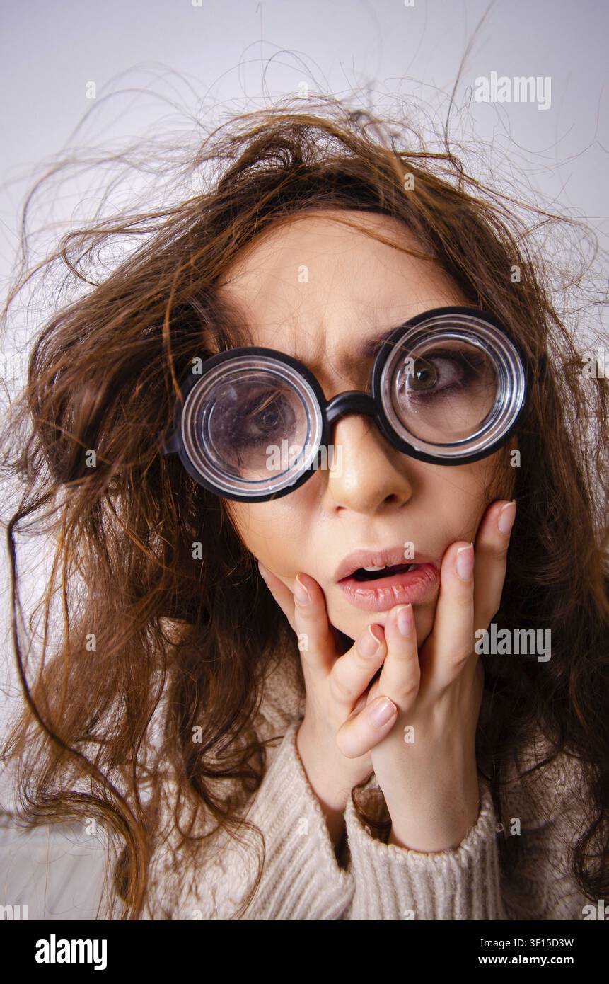 Funny nerd girl working on computer Stock Photo
