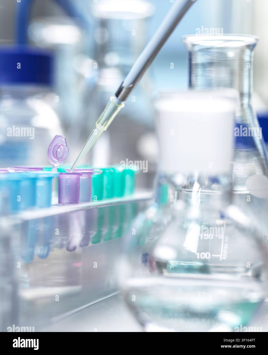 Genetic research, conceptual image. Scientist extracting samples using a pipette for analytical testing in the lab. Stock Photo