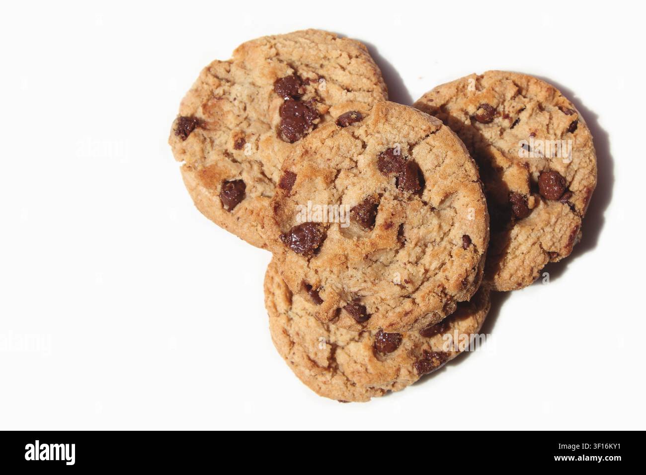 Close-up of four chocolate chip cookies/chocolate chip biscuits isolated in white background. Concept: dessert, sweet, delicious, bakery, pastry Stock Photo