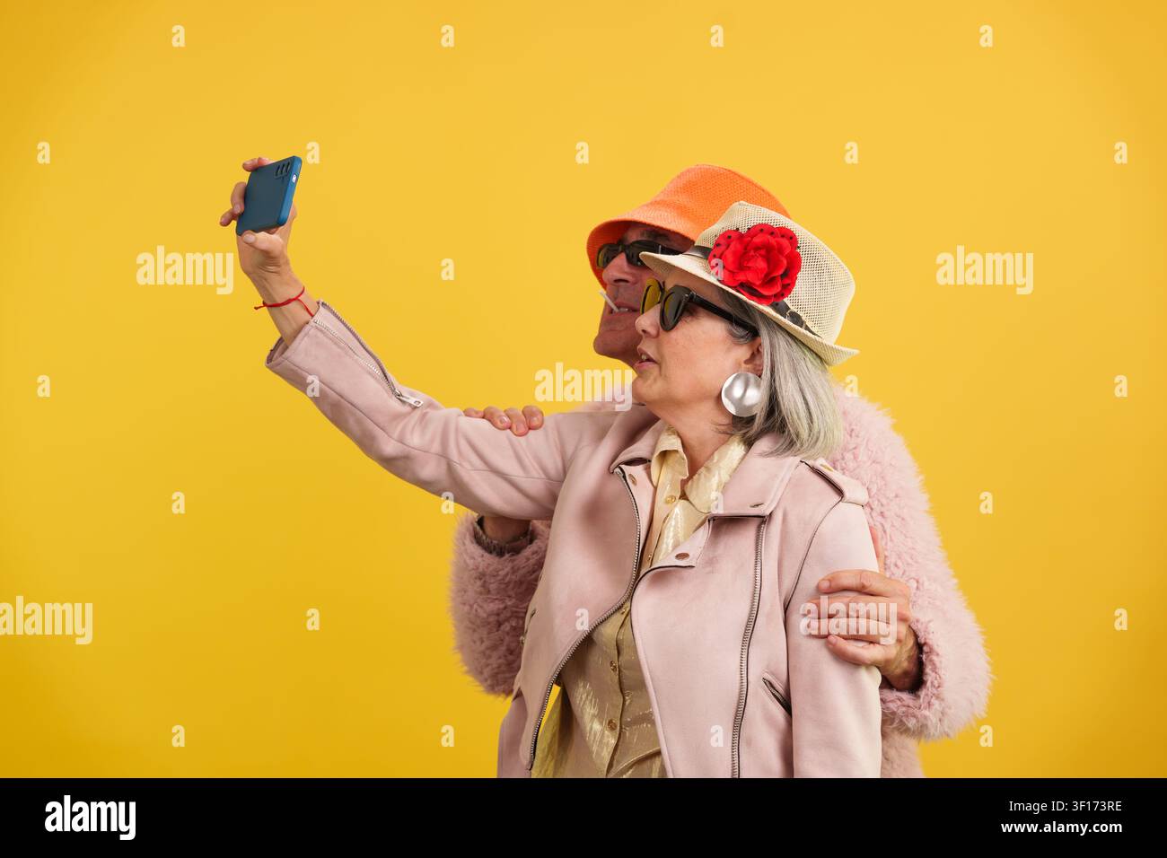 Stylish senior couple enjoying selfie and active maturity Stock Photo