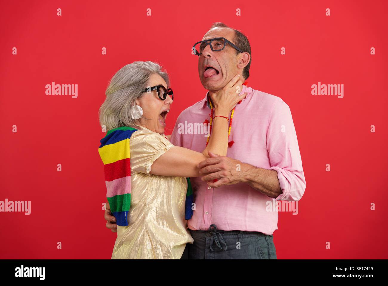 Aging couple having fun, humorous interaction, playing together Stock Photo