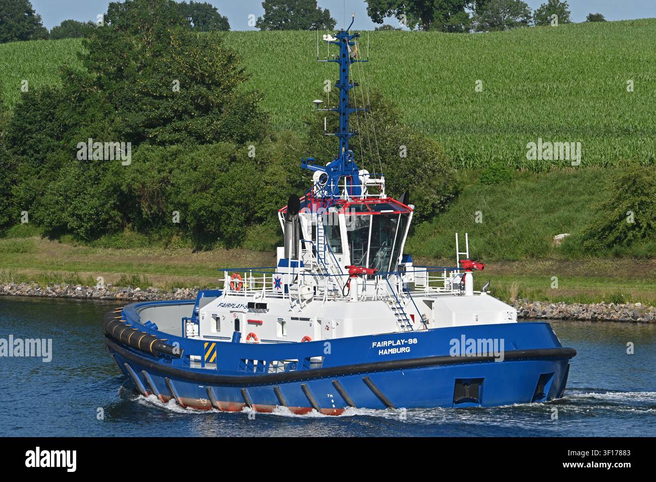 Tug FAIRPLAY-98 passing the Kiel canal Stock Photo