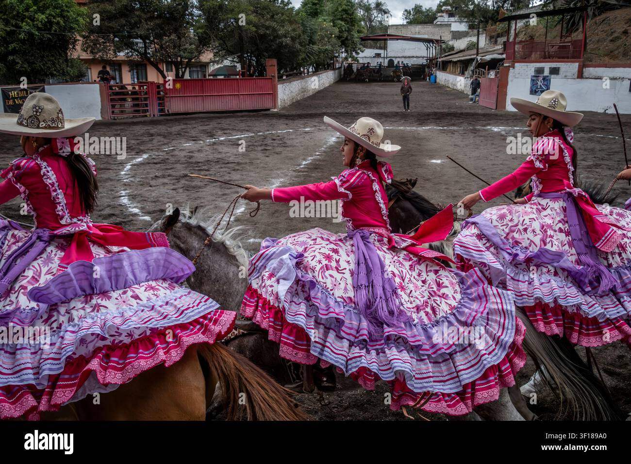 Charras or female riders compete in formation riding during an Escaramuza in Mexico City, Mexico Stock Photo