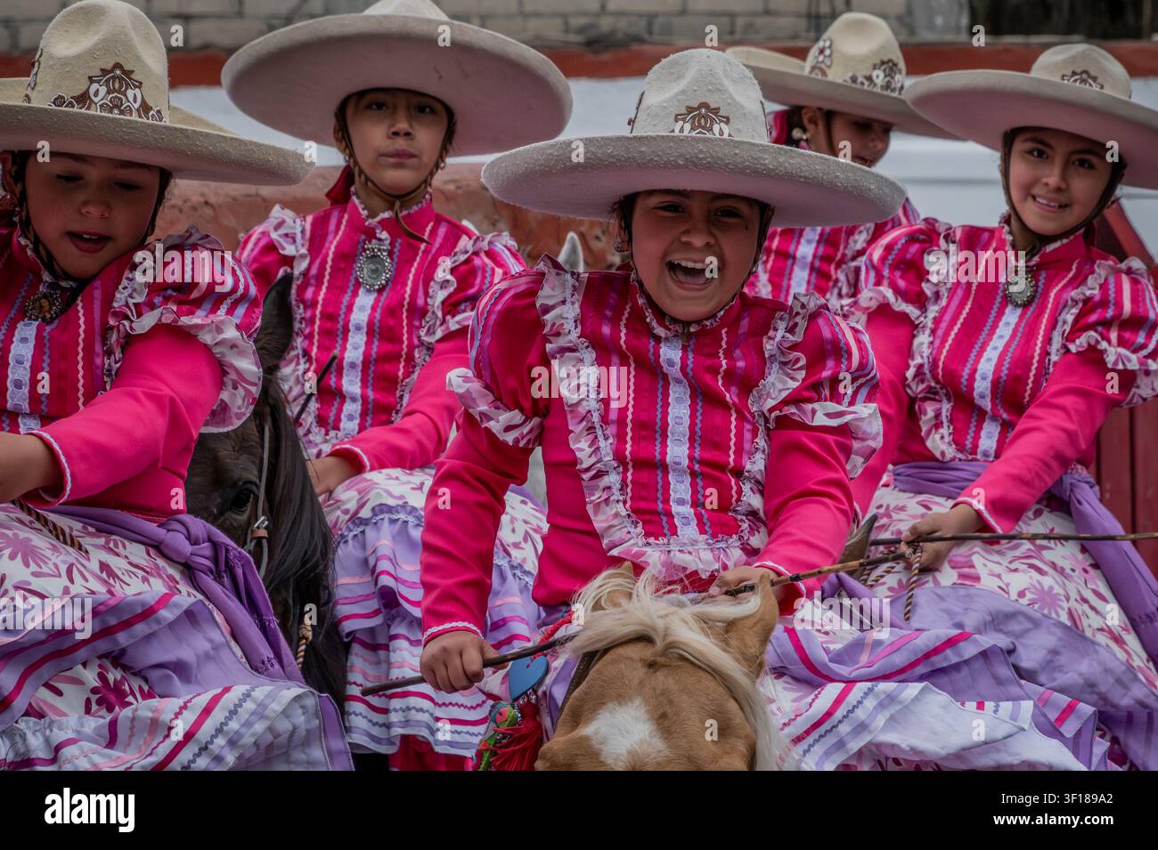 Young Charras or female riders compete in formation riding during an Escaramuza in Mexico City, Mexico Stock Photo