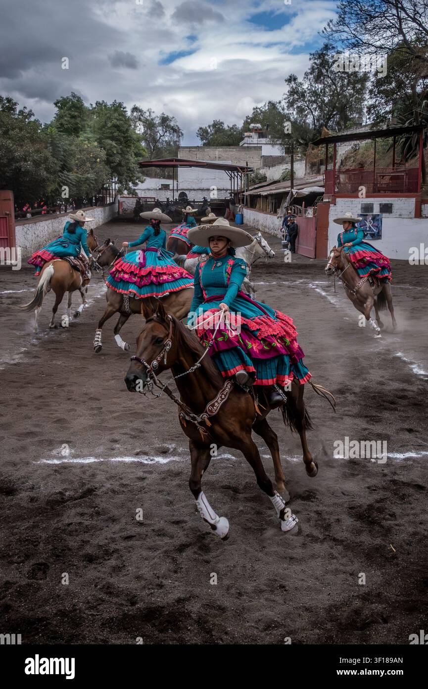 Charras or female riders compete in formation riding during an Escaramuza in Mexico City, Mexico Stock Photo