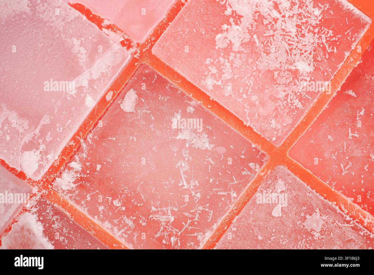 Colorful ice cubes on a flat surface during daylight hours Stock Photo