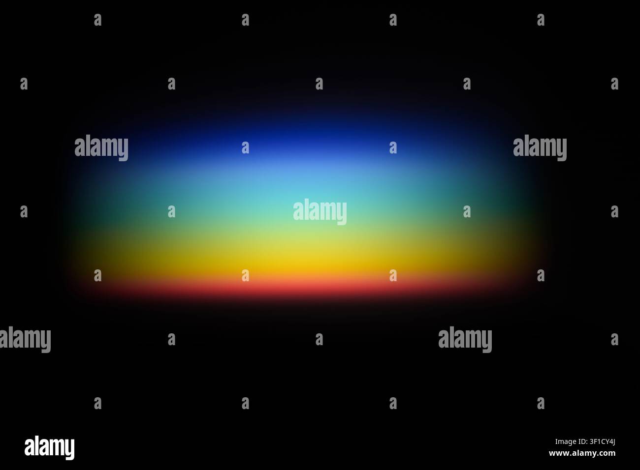 Light refracting through prism creating colorful rainbow spectrum on black background Stock Photo