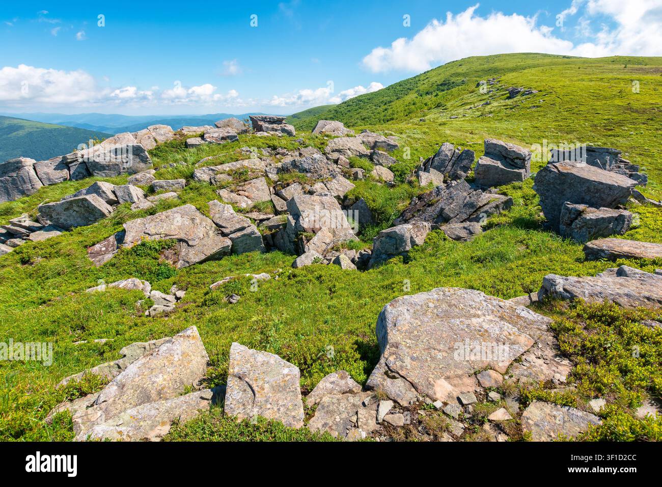 carpathian mountain landscape in summer. amazing background for outdoor adventure. transcarpathia green hill with rocks. sunny day with blue sky Stock Photo