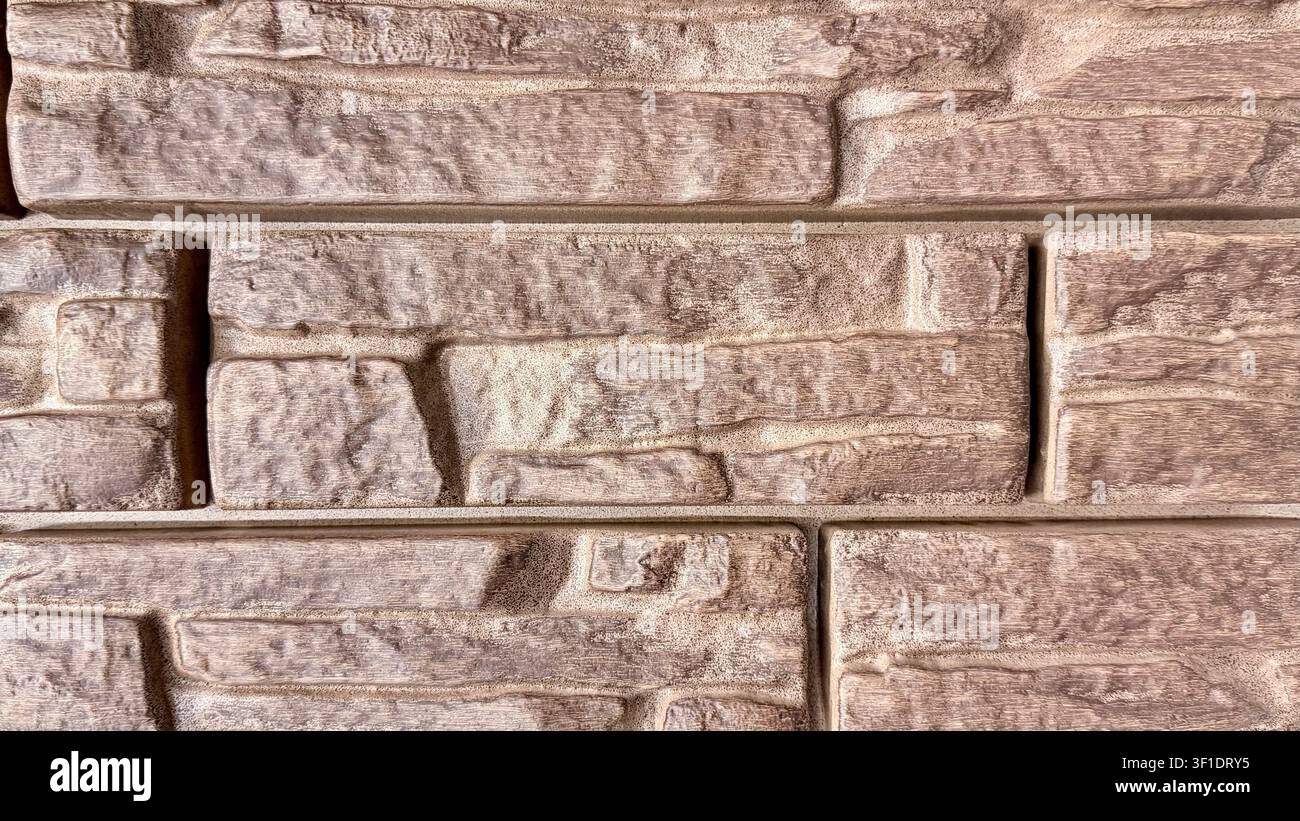 Brown decorative stone wall texture close up Stock Photo