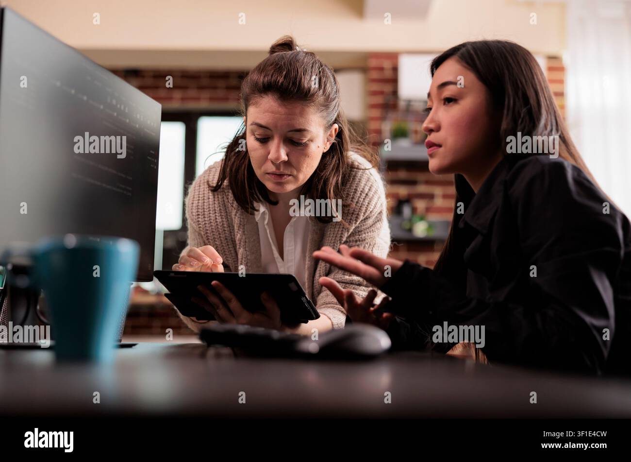 Diverse programming engineers analyzing html code on computer, planning artificial intelligence project, web developers working on machine learning software, developing new interface. Stock Photo