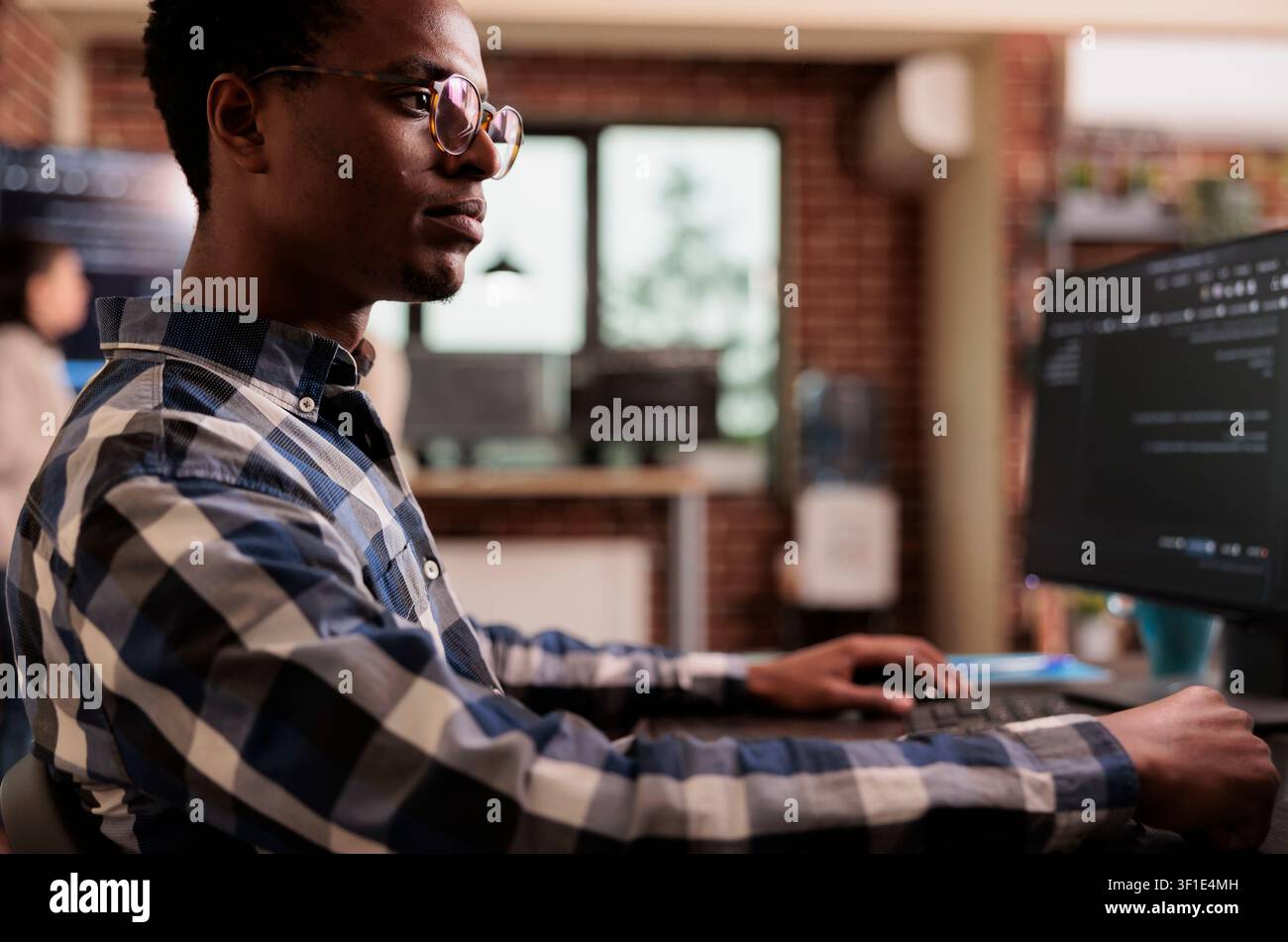 Programmers collaborating on HTML script in terminal window in a programming workspace, connecting source code, database logic and collaborative development for a technology project. Stock Photo