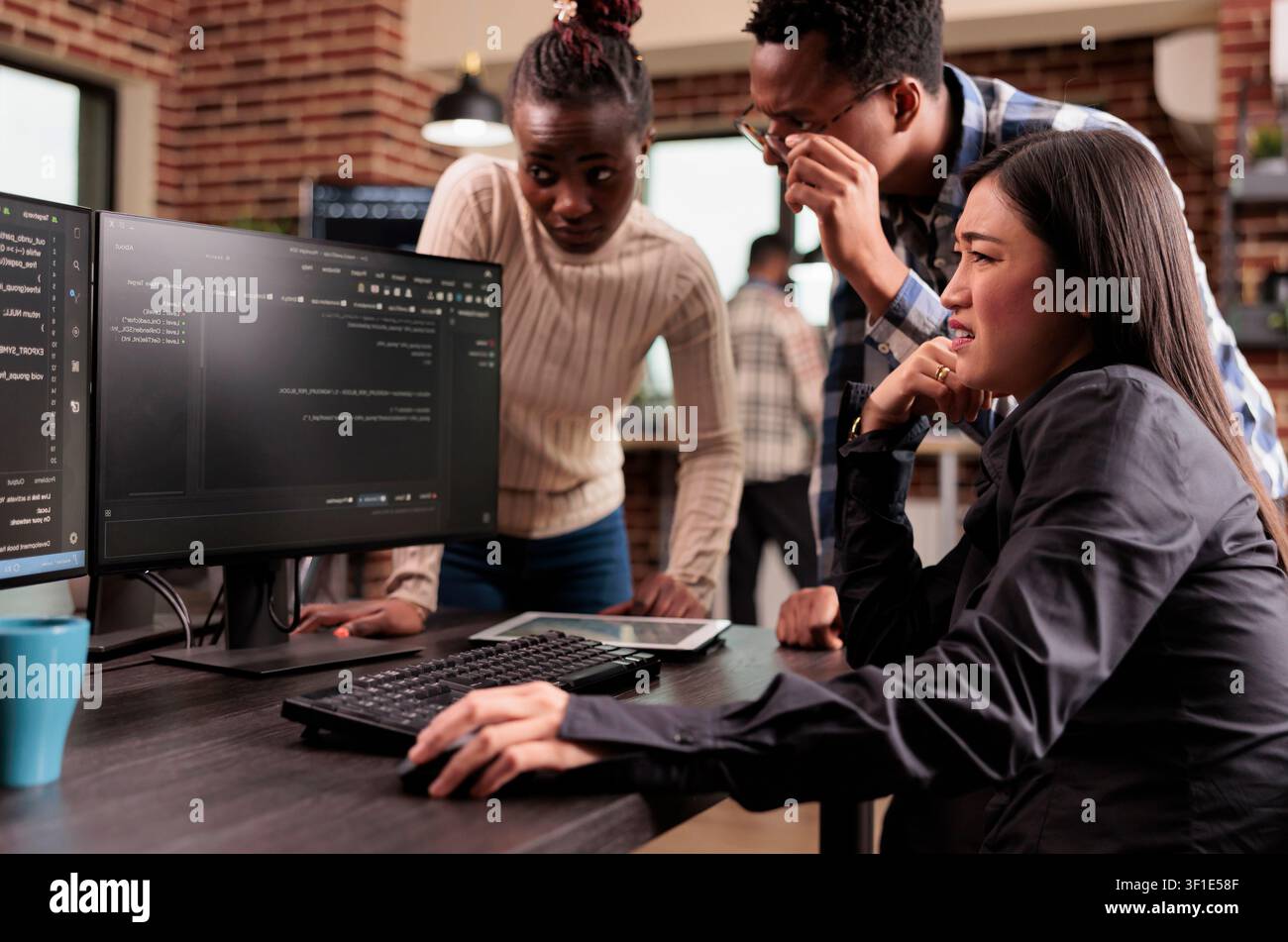 Diverse programming engineers talking about html script, looking at code on computer, working on server interface development, tech engineers parsing cloud computing project with big data in it. Stock Photo