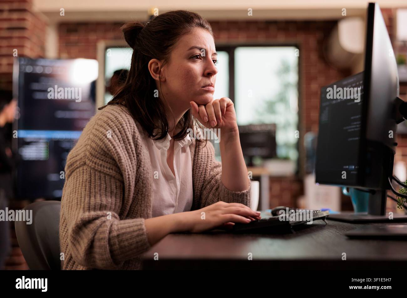 Freelance coder working with html script on terminal window, looking at computer screen and typing, with caucasian tech engineers writing innovating ai algorithm it developing it agency. Stock Photo