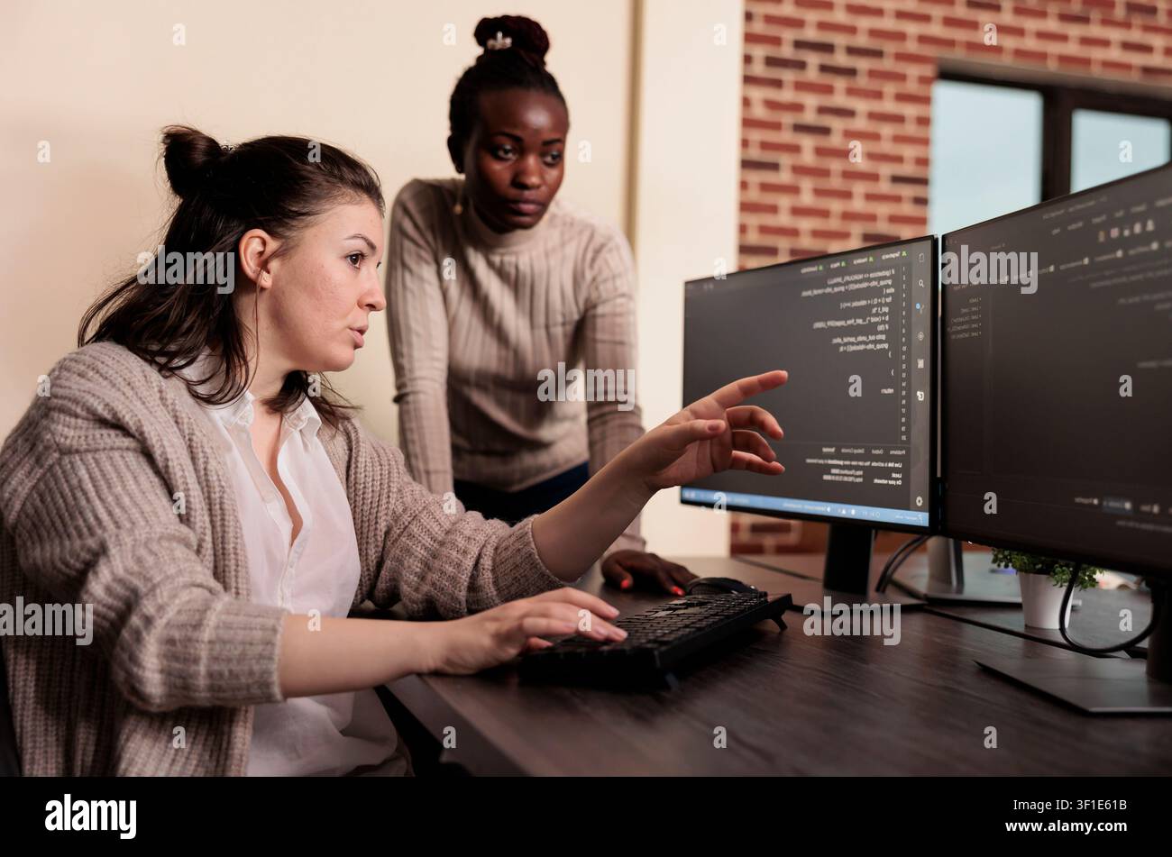 Team of software developers talking about programming in it development agency, Artificial intelligence cloud programers compiling app language innovating online server algorithms. Stock Photo