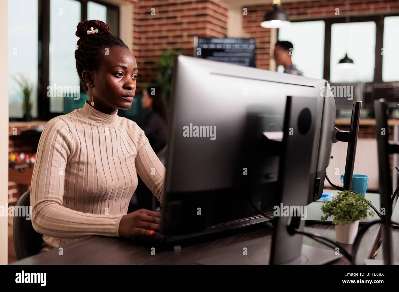 African american tech engineer typing big data code on computer, developing program using html script, Software developer writing ai algorithm working in it programming agency. Stock Photo