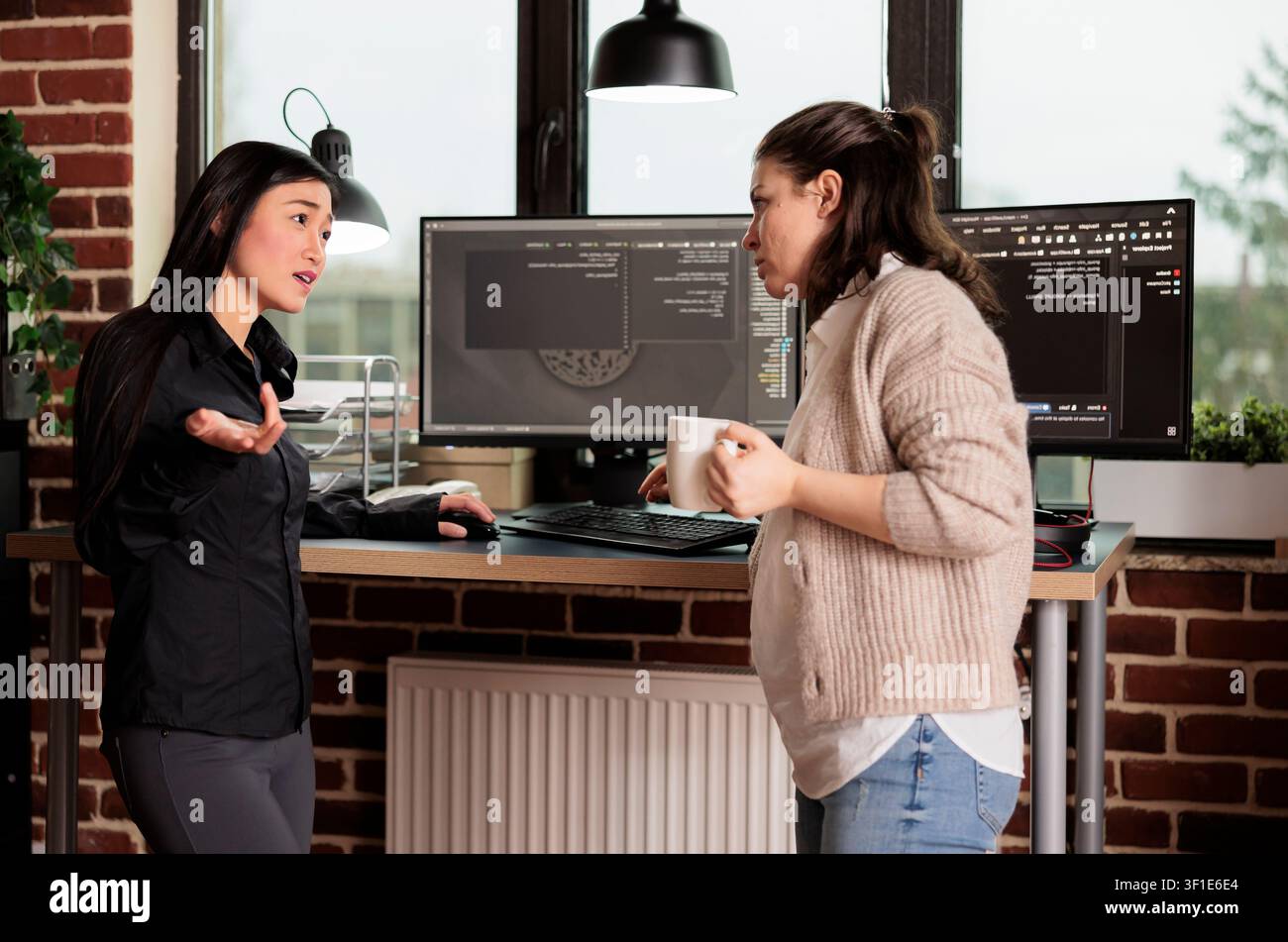 Diverse engineers developing software algorithm in server room while working with code, screens and digital infrastructure for software development. Stock Photo