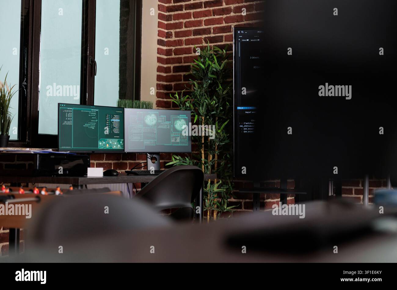 Empty server room with modern hardware in brick wall office while working with code, screens and digital infrastructure for software development. Stock Photo