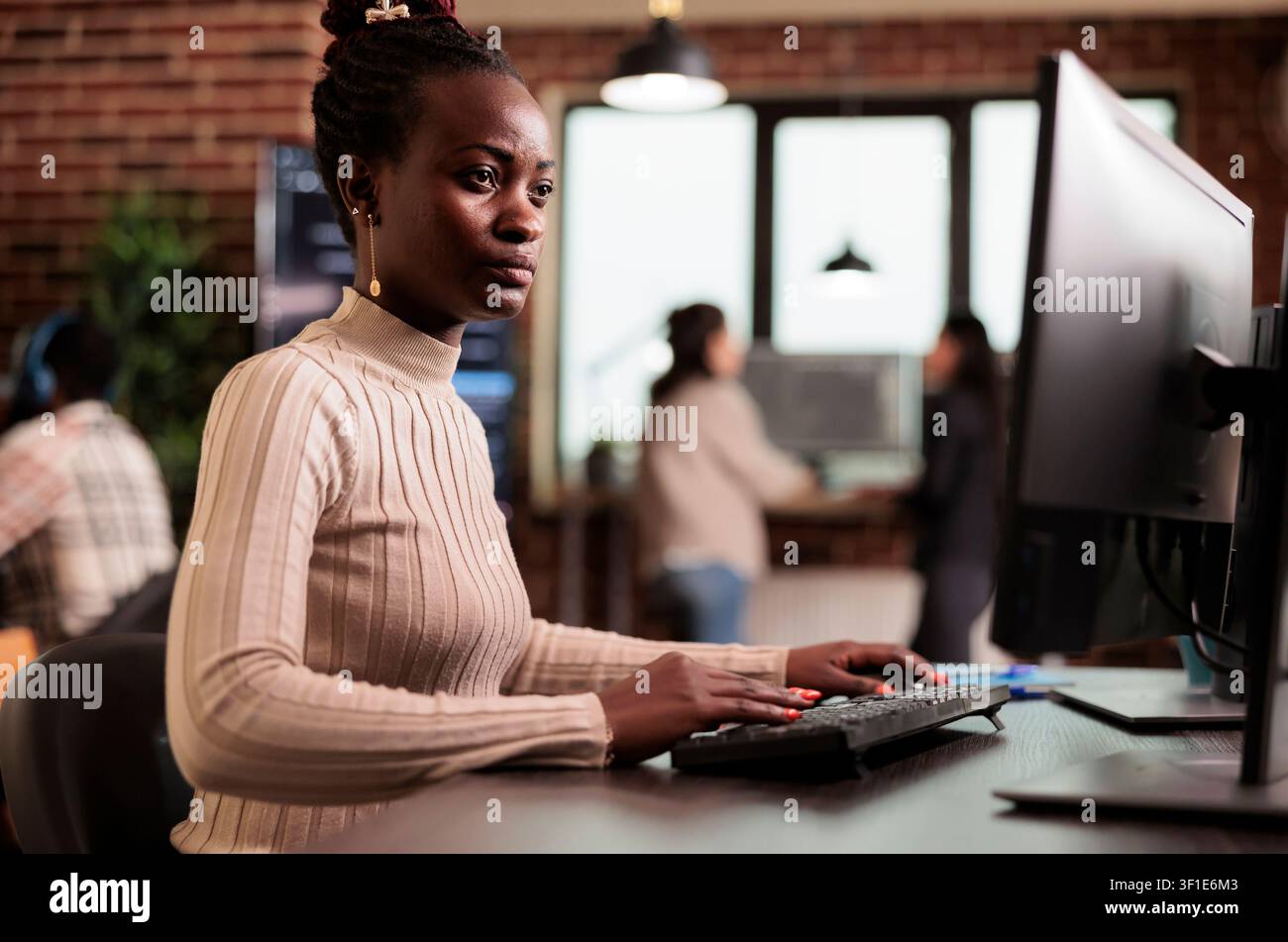 Software developer typing HTML terminal code in server room while working with code, screens and digital infrastructure for software development. Stock Photo