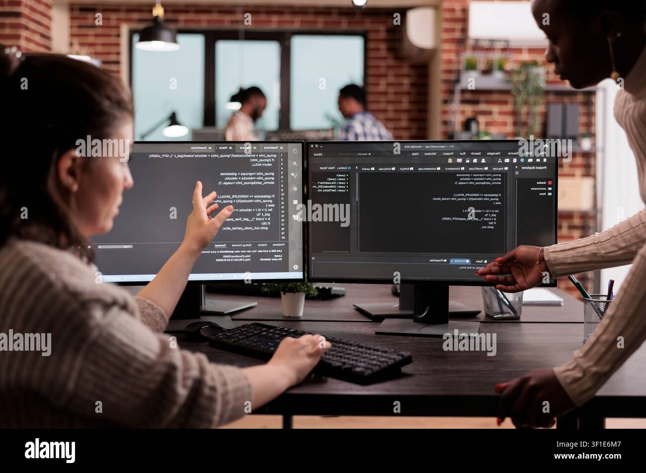Multiethnic developers building cloud code in server room while working with code, screens and digital infrastructure for software development. Stock Photo