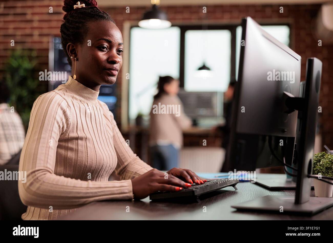 Software developer brainstorming ideas to write code and create new interface in data room. Tech enginner sitting at desk programming server database, working in busy it agency. Stock Photo