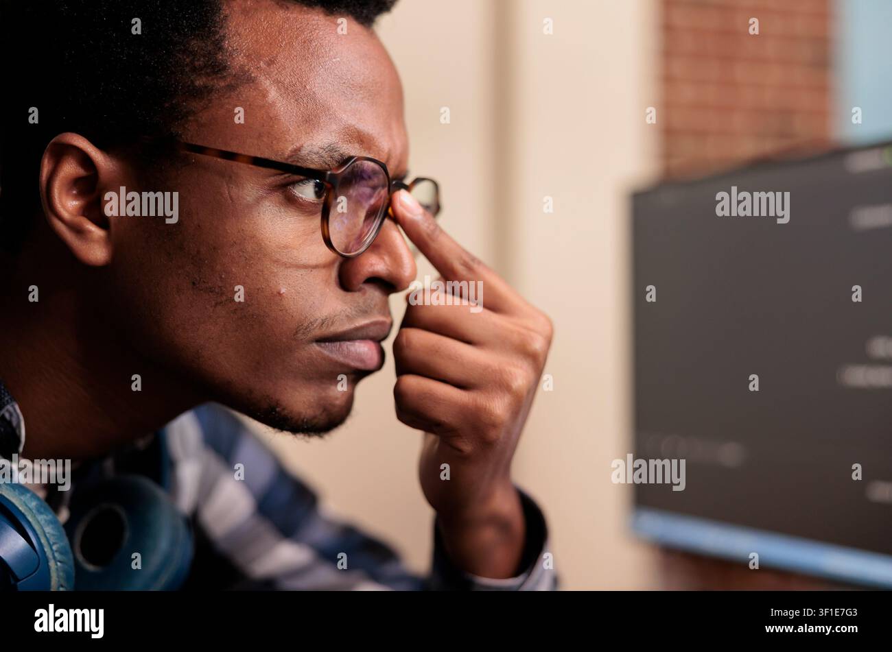 Software developer typing machine learning server code on computer, sitting at desk in software company. Programming engineer working on database system with coding script in it agency. Stock Photo