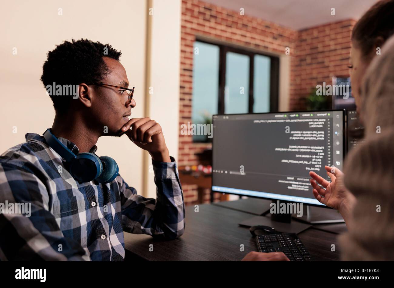 Diverse technology engineers develop a machine learning algorithm, collaborating on programming, data processing and software innovation. Stock Photo