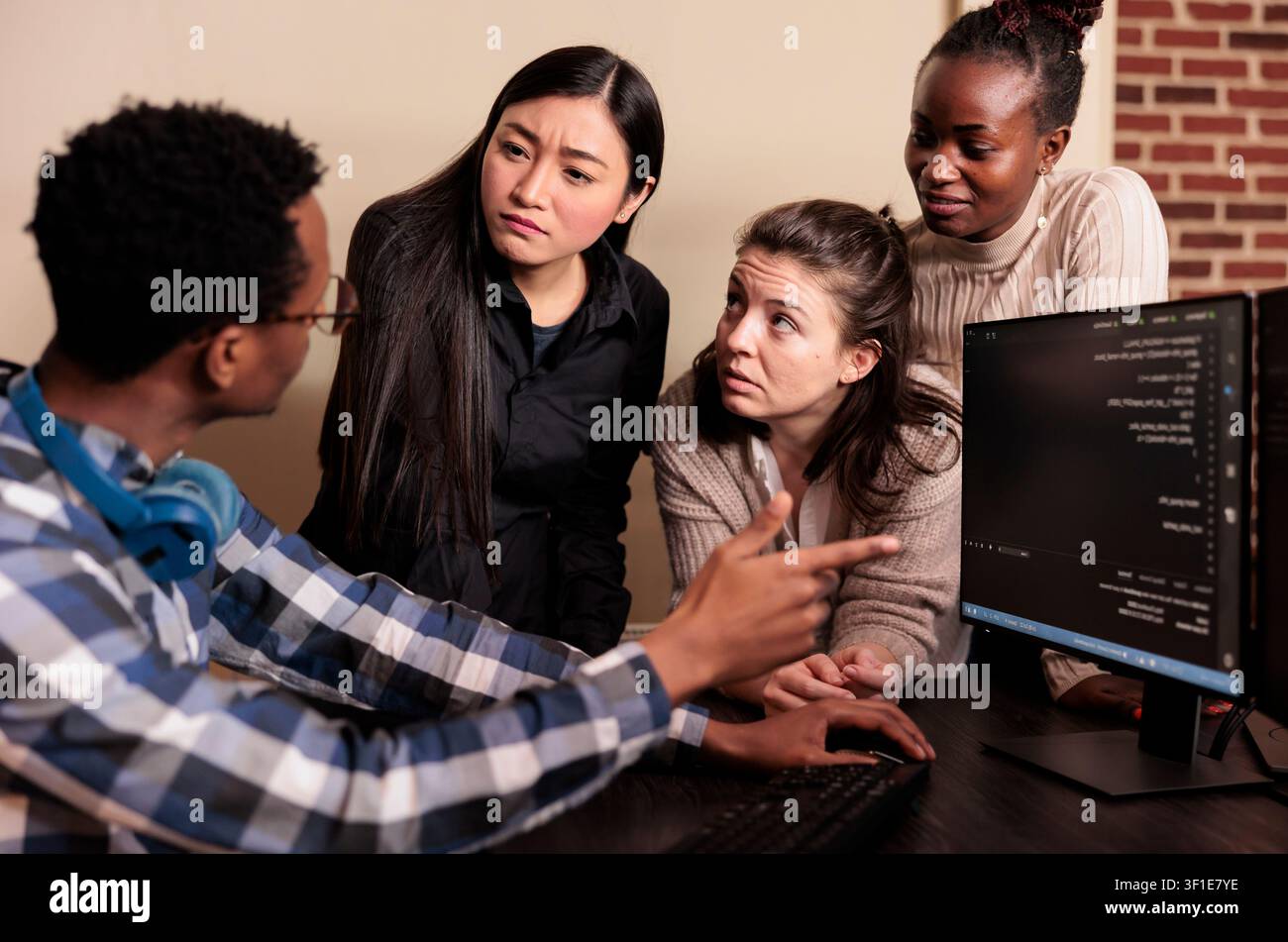 Diverse developers program business application, diverse software developers programming application, typing html code on computer. Stock Photo
