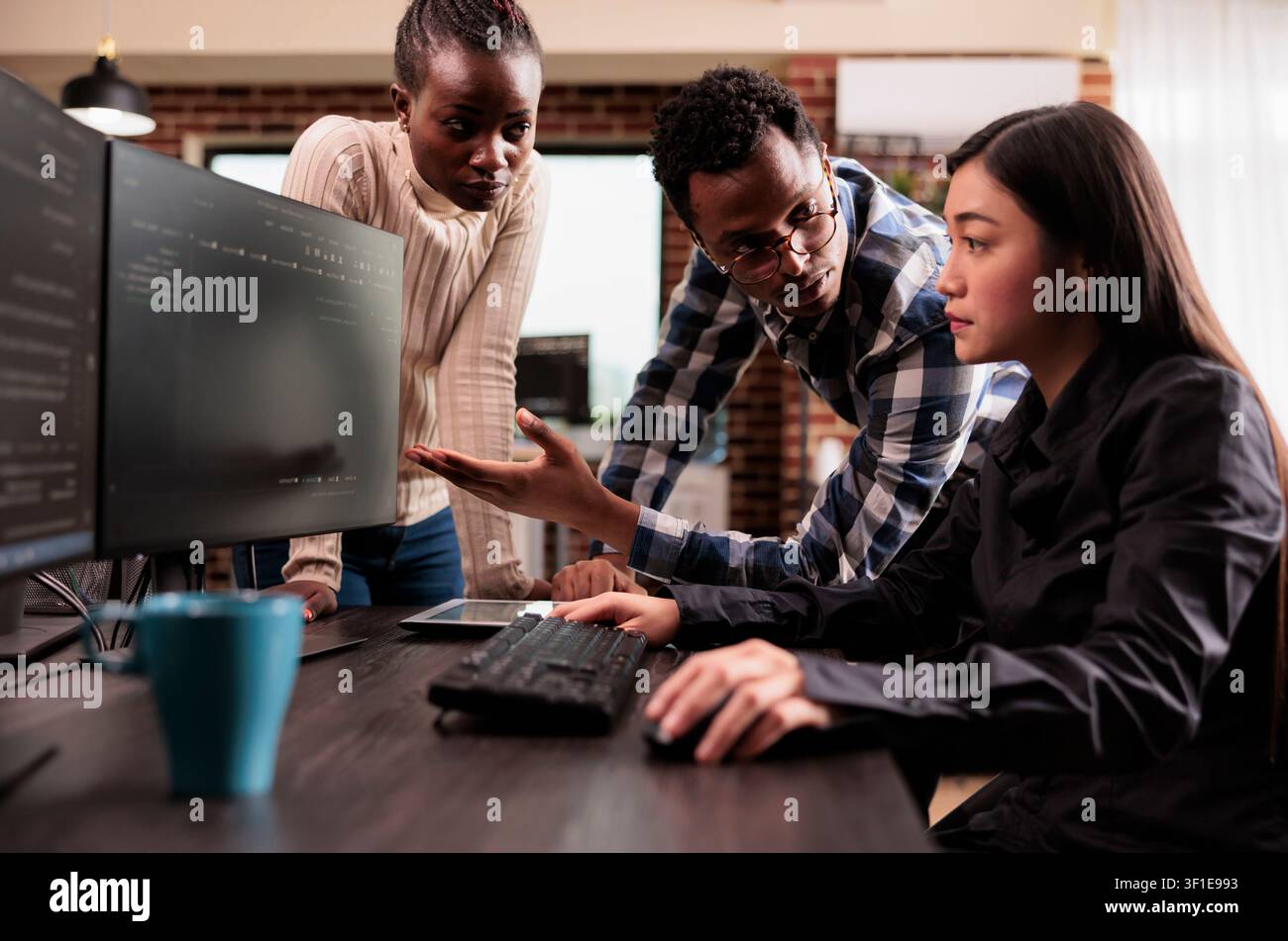 Diverse programmers discussing cloud interface code capturing looking at code on computer, working on server interface development, Programmers parsing cloud computing project with big data. Stock Photo