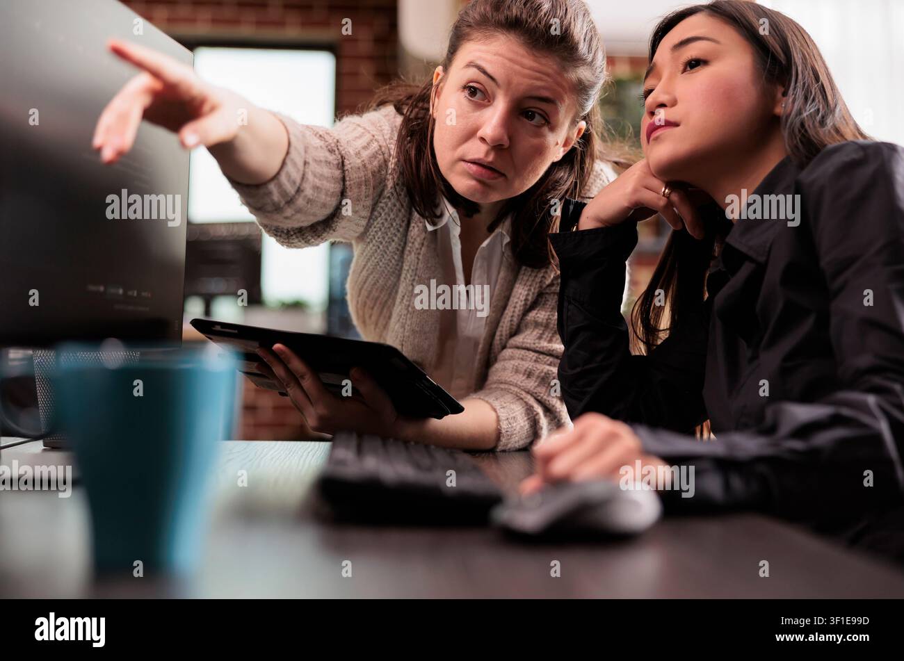 Software engineers collaborating on coding project presenting discussing about programming algorithm for new cloud computing working in it company. Stock Photo