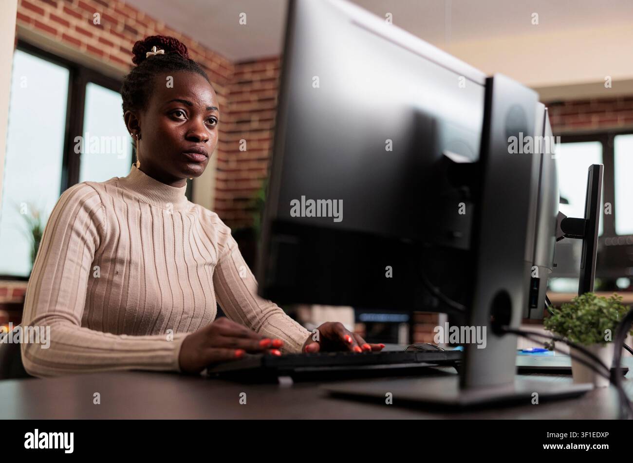Database administrator updates cloud file processing with an advanced compression algorithm, supporting secure platform information flow. Stock Photo