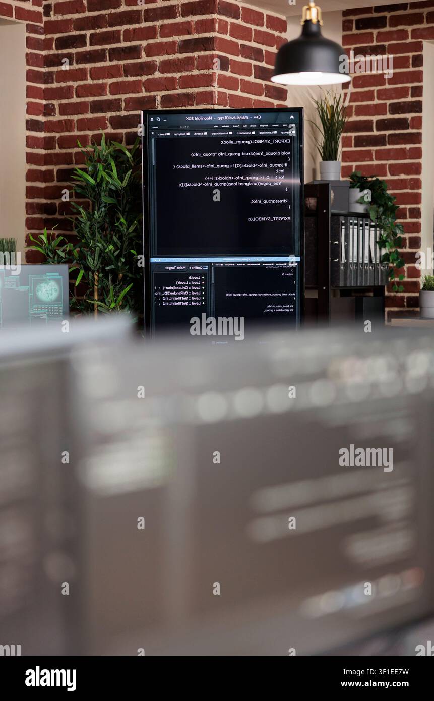 Empty data center office with programming screens during a focused IT task involving diagnostics, digital infrastructure and secure data processing. Stock Photo