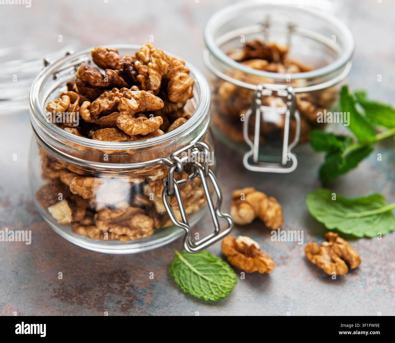 Walnuts without shell on a concrete background Stock Photo
