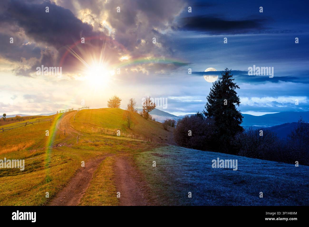 winding rural dirt path through hill. rolling countryside of ukraine on autumn equinox. cloudy sky at twilight. carpathian mountains in fall searon Stock Photo