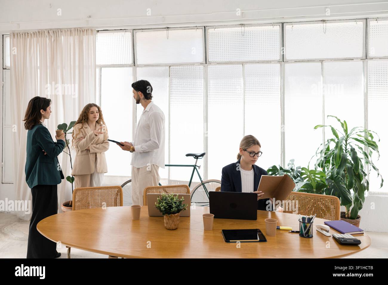 Diverse startup team collaborating at modern office Stock Photo