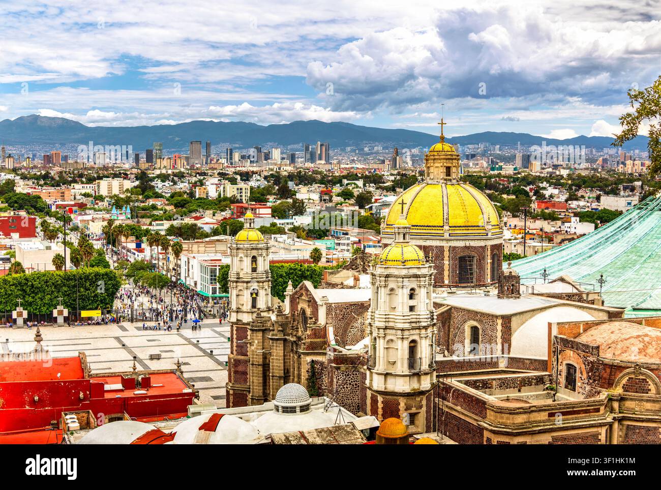 Basilica of Saint Mary of Guadalupe and Mexico City skyline Stock Photo