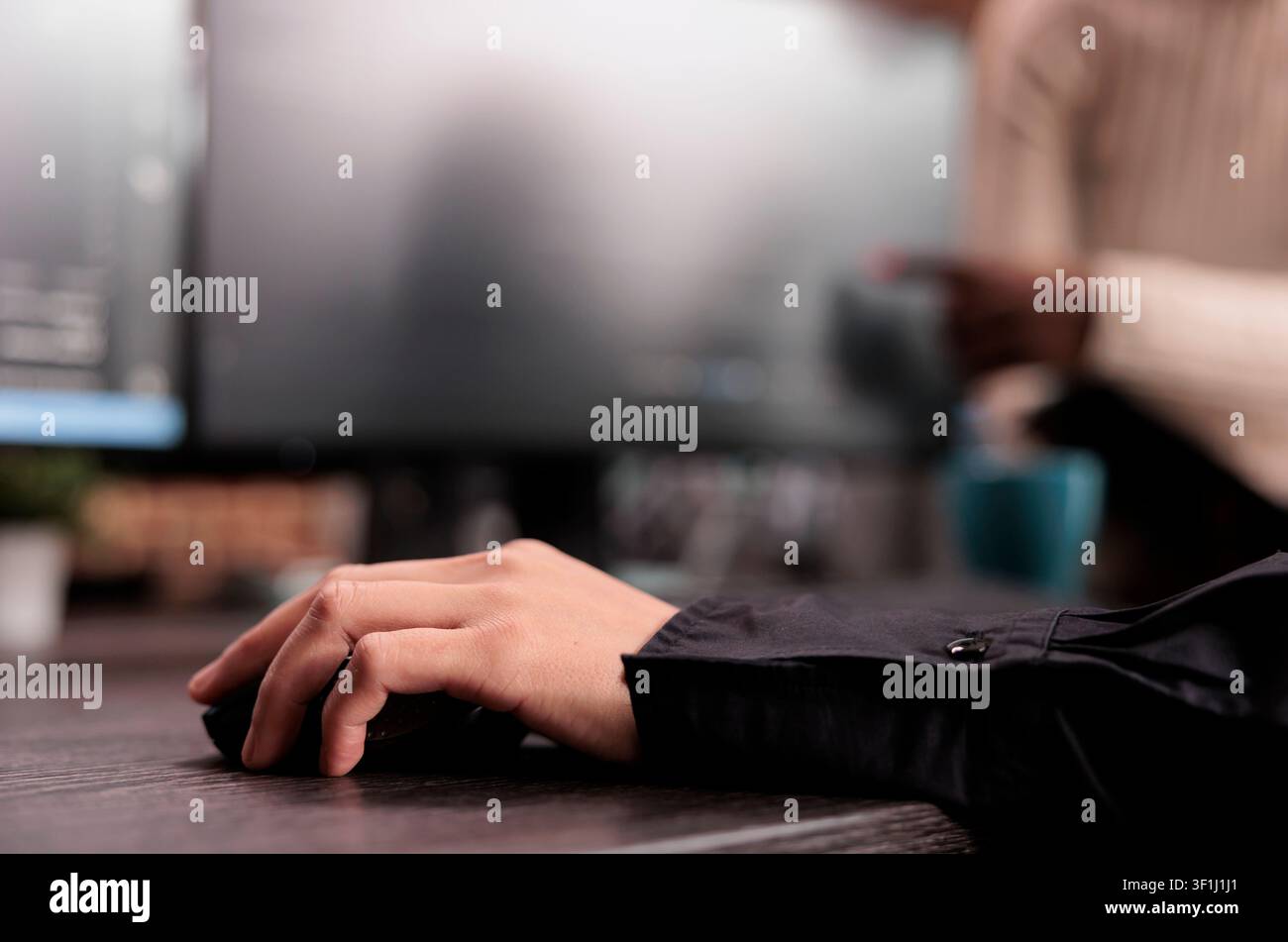 Software developer writes software code at an office desk, using computer screens, algorithms and database tools for digital application development. Stock Photo