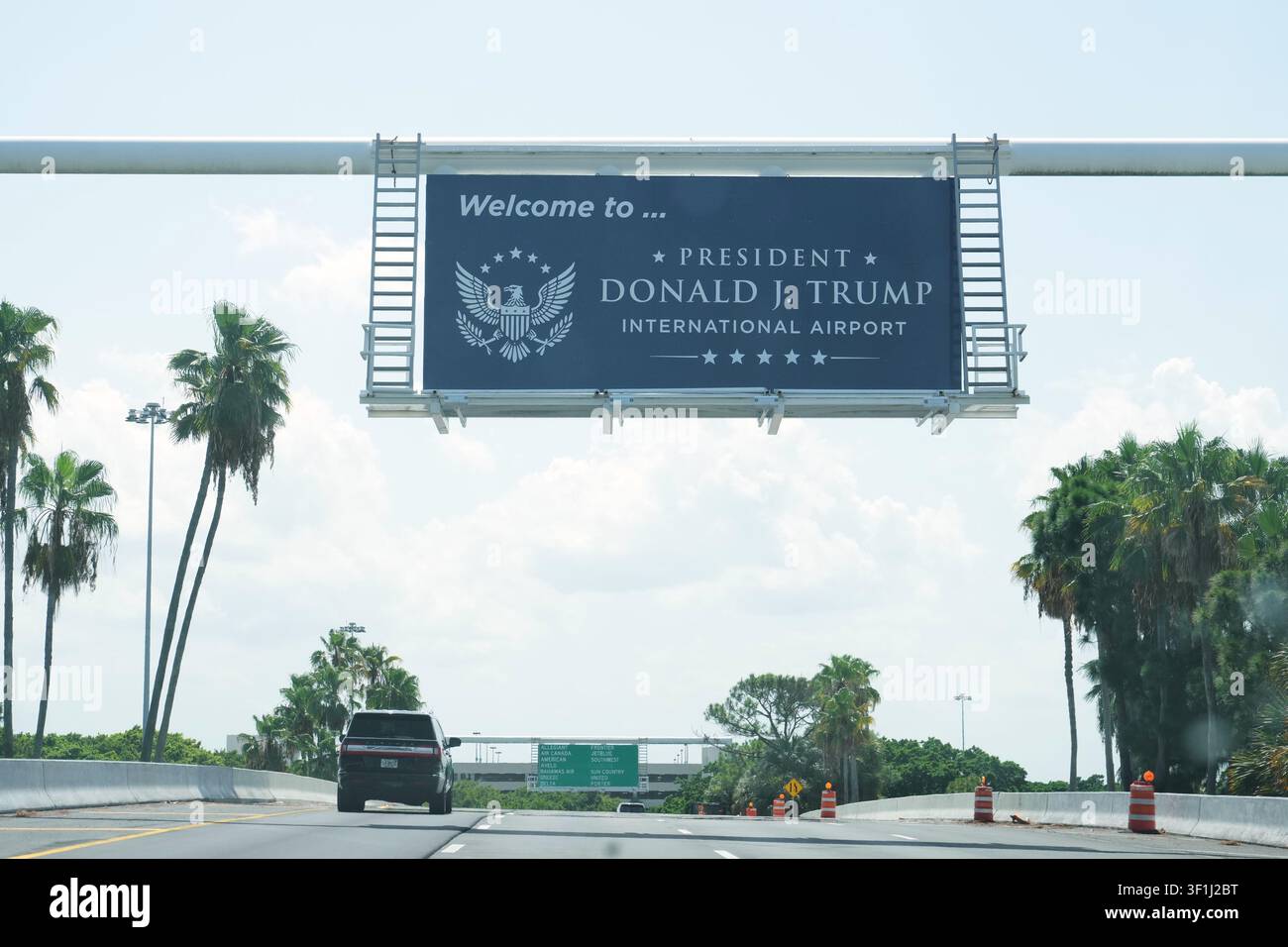 A sign displays the name of the rebranded Donald J. Trump International ...