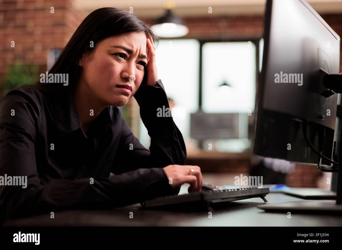 Overworked tech engineer struggles with development pressure around computer screens, showing developer teamwork, source code discussion and cloud programming workflow. Stock Photo
