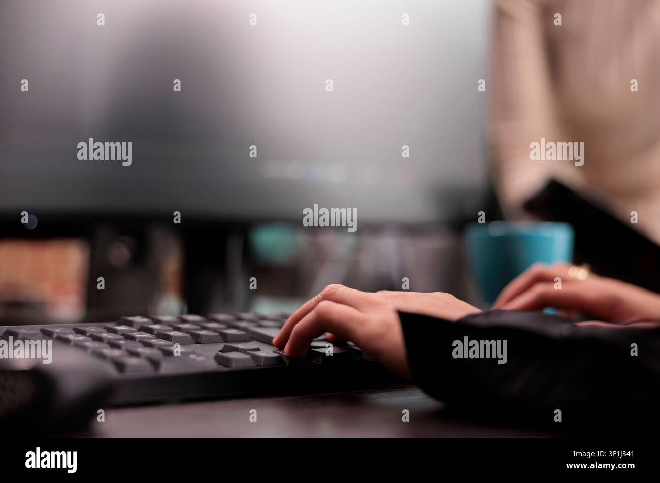 App developer types machine learning code on a computer while checking an artificial intelligence project and database script in a software office. Stock Photo