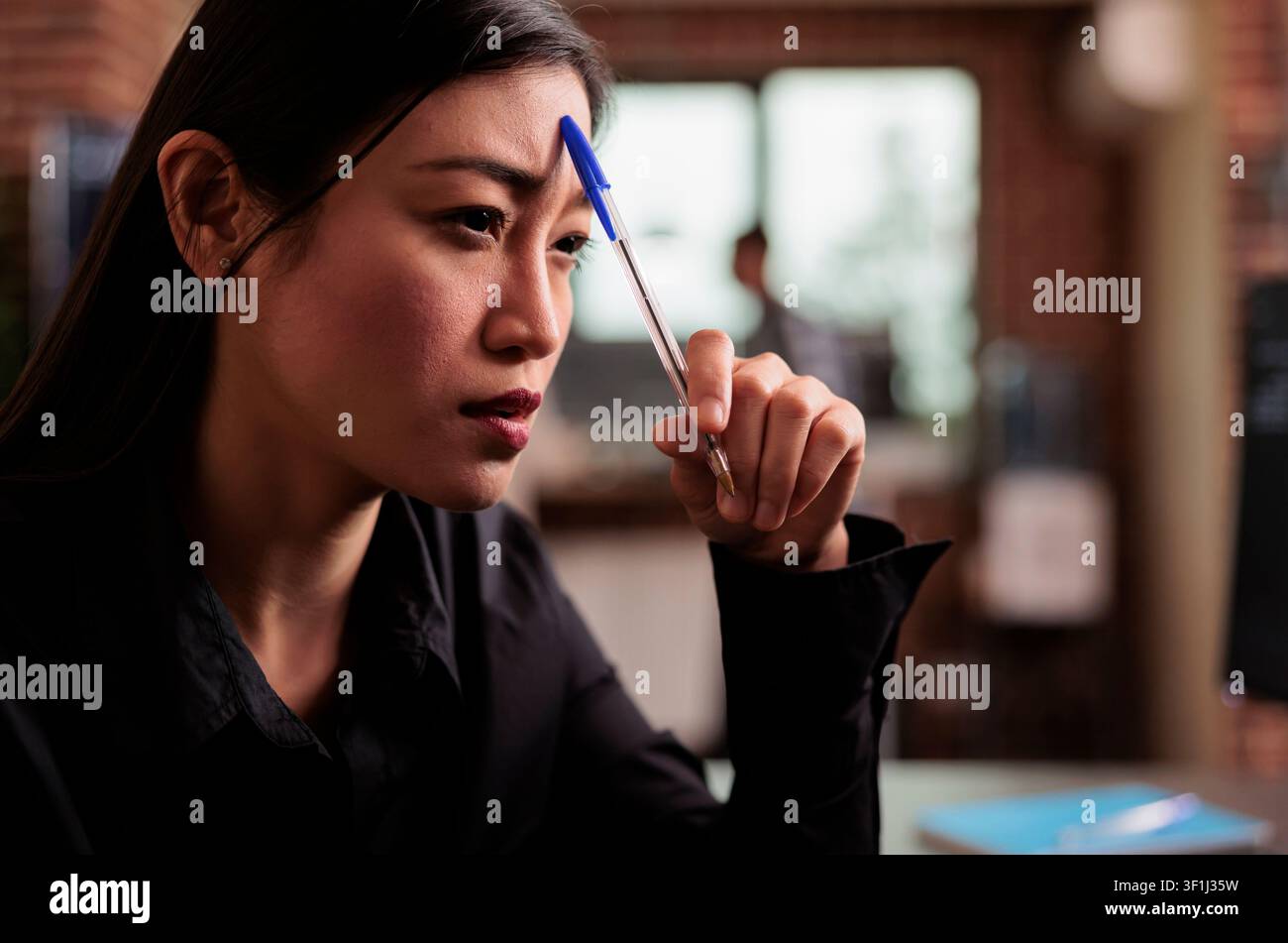 Tired tech programmer brainstorming ideas about coding solution, finding algorithm to create database script, developer feeling pensive and thinking about software developing system in it agency. Stock Photo
