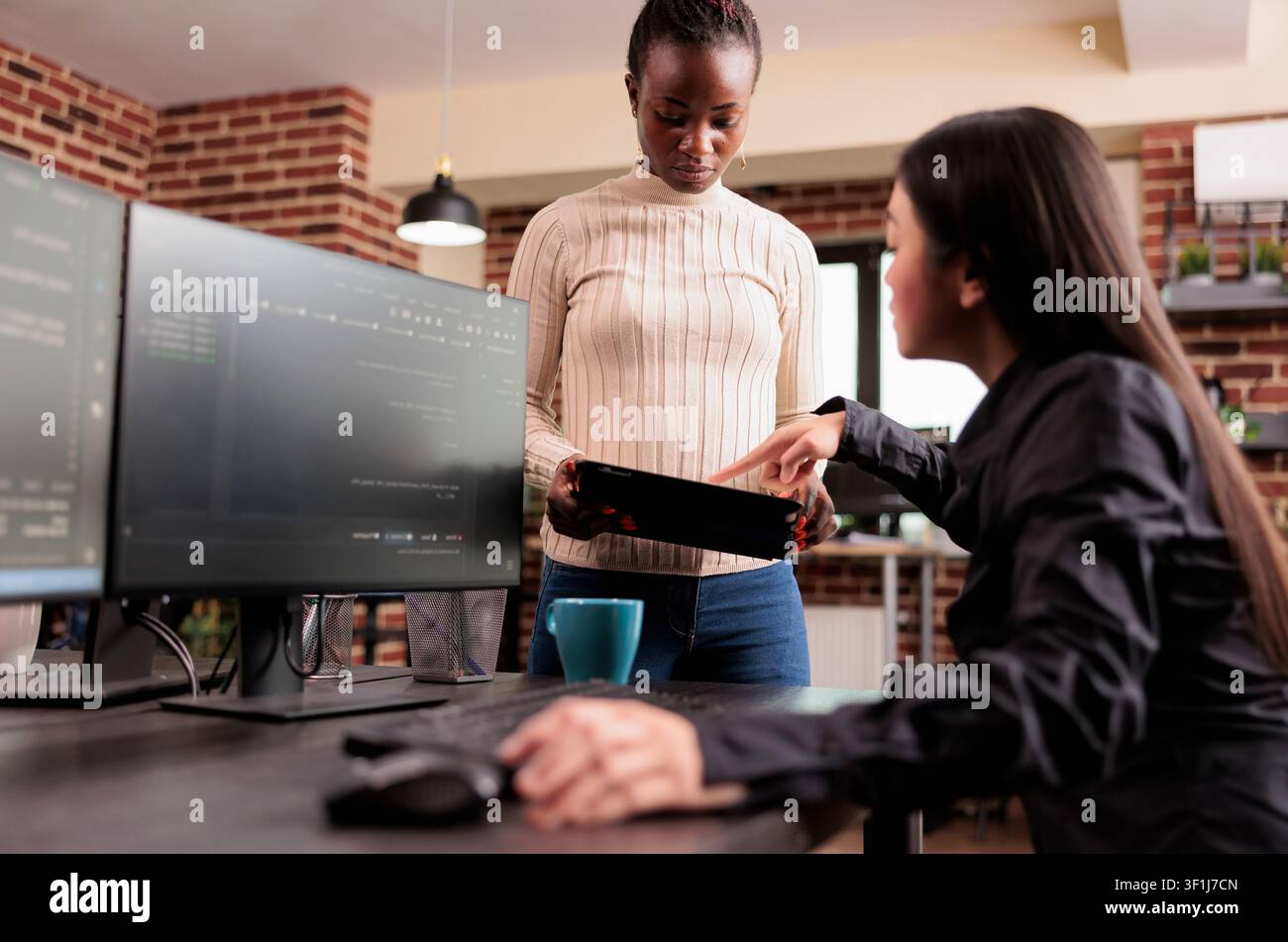 Team of software developers debugging algorithm working in it developing agency, Programming engineers analyzing source code on computer monitor, comparing data script in busy agency office. Stock Photo