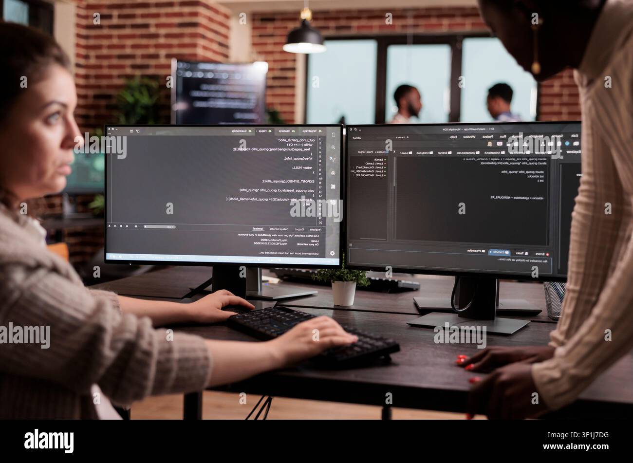 Diverse programming engineers developing html code and cloud computing in it development agency, Software developer working on database programming with html script, computing big data. Stock Photo