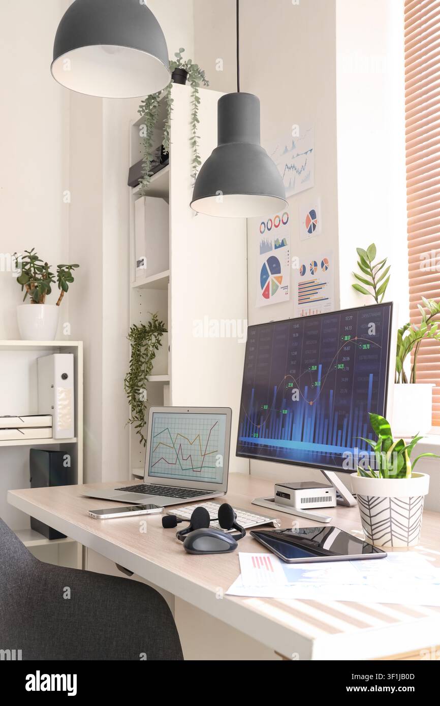 Data scientists workplace with computer and diagrams in office Stock Photo