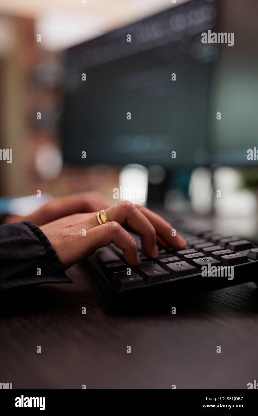 Security application engineer encrypts vital company information on a blockchain system while developing artificial intelligence data processing code. Stock Photo
