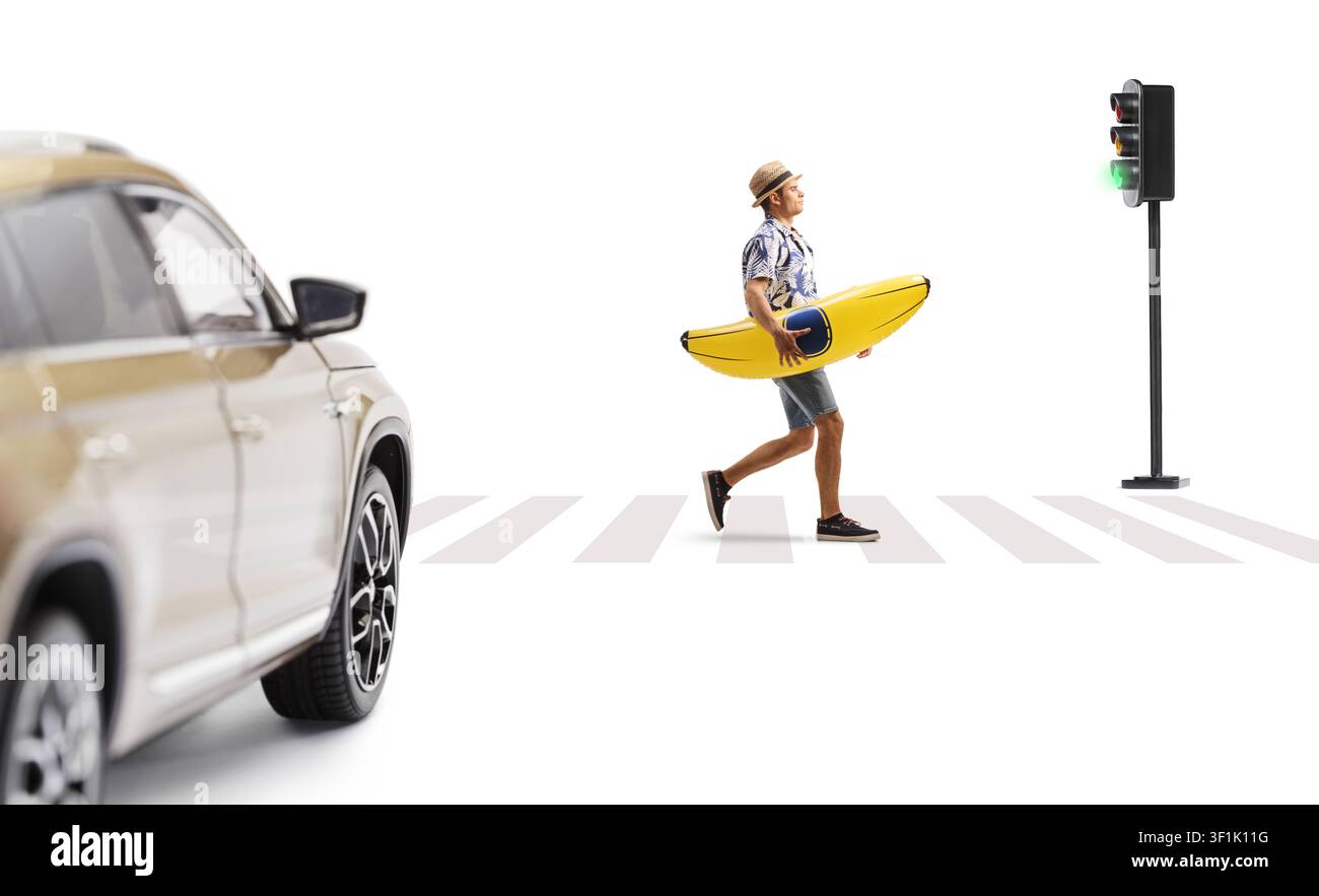 Man carrying a banana float at a zebra crossing isolated on white background Stock Photo