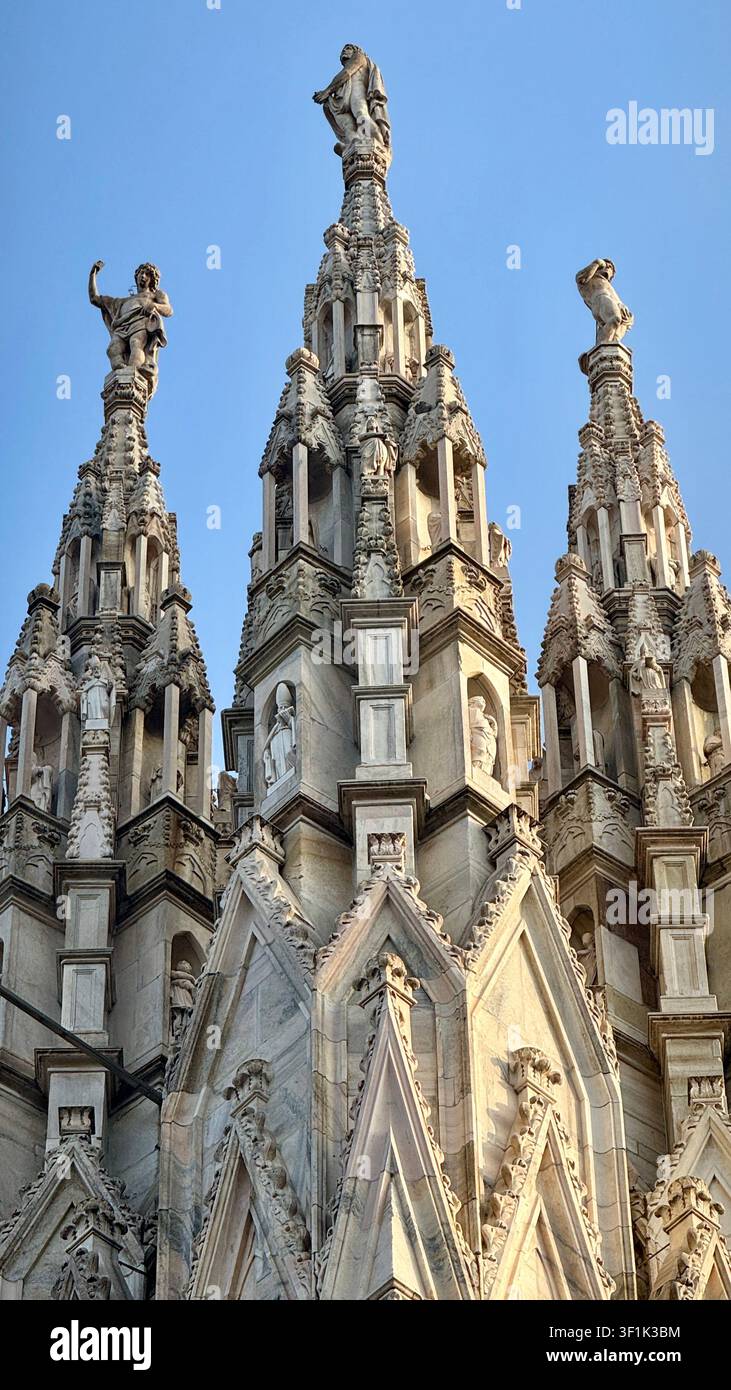 Statues on pinnacles and spires on the roof of the Duomo Cathedral of Milan Lombardy Italy - Smartphone Captured Stock Image